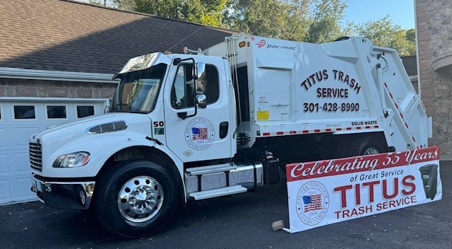 titus-trash-truck-with-55-years-banner-front